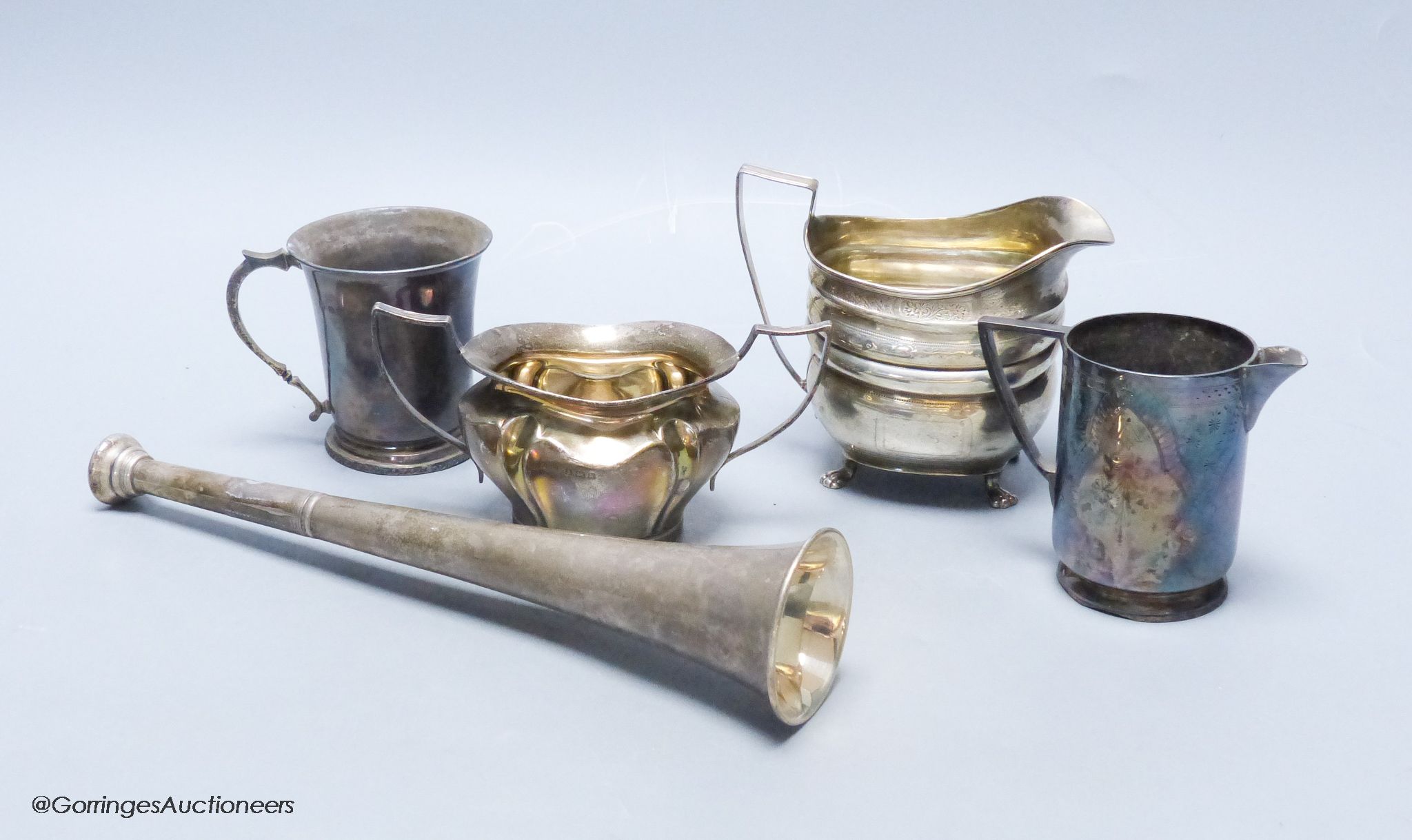 A Victorian silver hunting horn, London 1898, Sampson Mordan & Co, a Georgian bright-engraved silver oval cream jug and three other items, 18.05oz